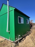 Mini-maison avec cuisine et toilettes sèches