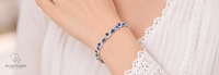 Bracelet tennis de luxe en or blanc 18 carats avec saphirs bleus et diamants, design vague, pavé d'accentuations de saphirs de laboratoire, bijou raffiné intemporel