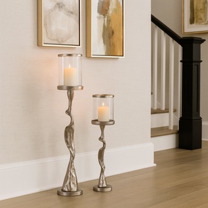 Set Of <b>Hurricane</b> <b>Candle</b> Holders Features Striking Organic Form Base With Textured Metallic Finish With Clear Glass Cylinders - Product Image 1