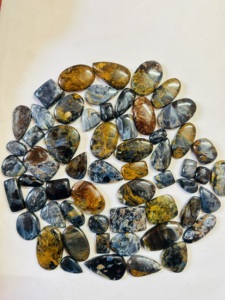 พลอยบลูพีเตอร์ไซต์เกรดท็อป รูปทรงคาโบชอง ลายธรรมชาติ พร้อมเอฟเฟกต์ไฟ  ขายส่งจำนวนมาก พลอยพีเตอร์ไซต์หลายสี - Product Image 3