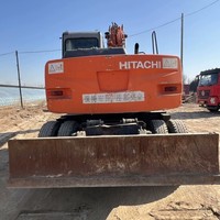 Garantie de satisfaction - Excavatrice sur pneus d'occasion HITACHI ZX130W avec une grosse réduction à vendre