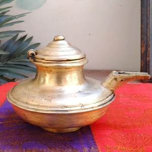 Charming antique brass ghee <b>pot</b> rests gracefully on a natural stone with a custom spoon. Available at wholesale price. - Product Image 4