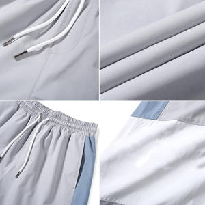 เสื้อแจ็คเก็ตกันลมแบบพรีเมียมสีเทาและสีน้ำเงินพร้อมกางเกงคาร์โก้ – ปรับขนาดได้พร้อมดีไซน์ทันสมัย – ขายส่งจากสหรัฐอเมริกา - Product Image 3