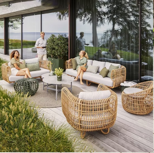 Conjunto de muebles de patio de mimbre oscuro con cojines de asiento verde brillante y mesa de centro, disponible a precios de mayorista. - Product Image 4