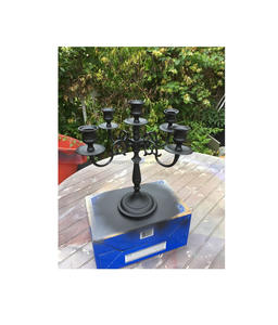 Elegant <b>black</b> iron <b>candelabra</b> handcrafted with scroll arms for use in historic homes wedding setups or garden parties - Product Image 2