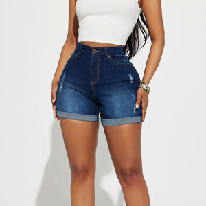 Shorts de mezclilla ajustados rasgados para mujer, de cintura media, estilo casual de verano, elásticos, 100% algodón, con bolsillos y efecto desgastado. - Product Image 1