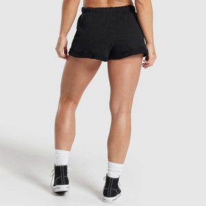 Shorts de sport noirs non tissés pour femmes, taille haute élastique, coupe régulière, respirants, séchage rapide, couleur unie, logo sur la jambe gauche, 100 % coton - Product Image 5