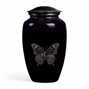Urna Funeraria de Metal Negro con Mariposa Voladora para Uso en Funerarias, Directo de Fábrica - Product Image 1