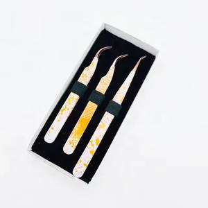 Pinces à cils de précision en acier inoxydable avec poignées à motifs jaunes, pointe lisse pour une application détaillée - Product Image 2