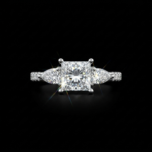 Bague classique en or blanc avec diamant taille princesse, deux pierres latérales en forme de poire et détails pavés ronds - Product Image 1