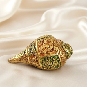 Intricately carved vintage brass shankh displaying detailed artwork, ideal for gift, available at wholesale prices. - Product Image 1