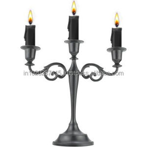 Candelabro de hierro con brazos detallados y acabado envejecido para mejorar el estado de ánimo de dramas históricos o escenarios de teatro - Product Image 3