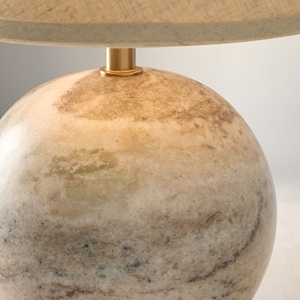 Solución de iluminación para mesa de piedra refinada que ofrece una geometría redondeada artística, artesanía de primera calidad e iluminación ambiental suave. - Product Image 2