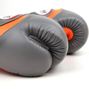นวมชกมวยรุ่นใหม่ TWINS Boxing Long Cuff สีเทาและสีส้ม  นวมชกมวยหนังแท้คุณภาพสูง สำหรับฝึกซ้อมและแข่งขันระดับมืออาชีพ เหมาะสำหรับใช้ในยิม - Product Image 4