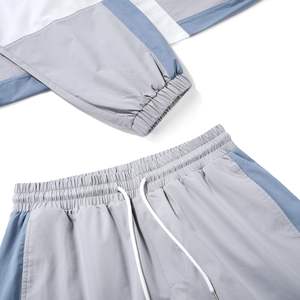 เสื้อแจ็คเก็ตกันลมแบบพรีเมียมสีเทาและสีน้ำเงินพร้อมกางเกงคาร์โก้ – ปรับขนาดได้พร้อมดีไซน์ทันสมัย – ขายส่งจากสหรัฐอเมริกา - Product Image 4