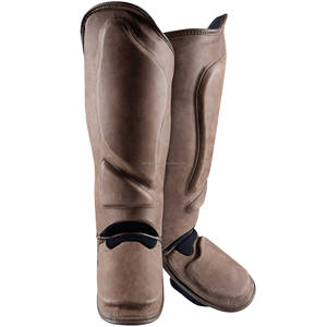 Espinilleras de cuero de vaca con logotipo personalizado de alta calidad MMA y Muay Thai Boxing Shin Protector para deportes de fútbol - Product Image 1