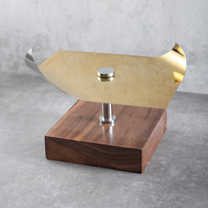 Modern Style <b>Cake</b> <b>Stand</b> Featuring A Curved Polished Gold Metal Wing Plate Atop A Square Natural Wooden Block Base <b>Stand</b> For Home - Product Image 1