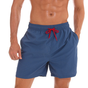 Shorts de bain décontractés pour hommes en toile bleue unie, taille élastique mi-haute, séchage rapide, écologiques - Product Image 1