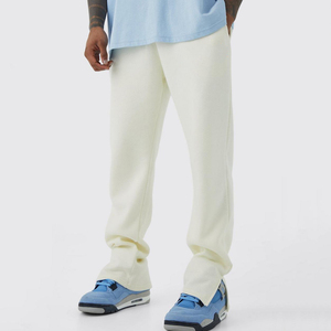 Pantalones de chándal de felpa holgados de pierna ancha para hombre, color blanco cremoso, con dobladillo apilado y abertura, estilo lounge, streetwear y casual - Product Image 1