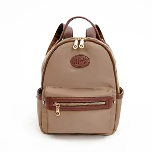 กระเป๋าเป้สะพายหลังขนาดเล็กสำหรับผู้หญิง โลโก้สั่งทำได้ กันน้ำกระเซ็น แฟชั่นทันสมัย สายรัดซิป ใช้วัสดุไมโครไฟเบอร์ผสมหนังสังเคราะห์ - Product Image 1