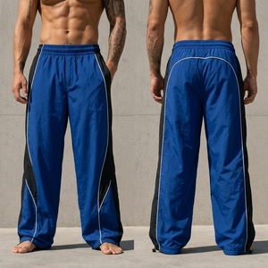 Pantalon de survêtement bleu pour homme avec bande latérale, taille élastique, séchage rapide, léger, décontracté, en polyester, pour l'été - Product Image 1
