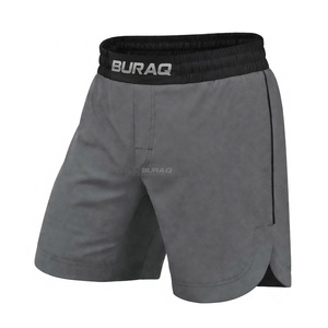 กางเกงชกมวย MMA แบบสั่งทำพิเศษสำหรับผู้ชาย สำหรับฝึกซ้อม สวมใส่สบาย เอวยางยืด ผ้าฝ้าย 100% ระบายอากาศได้ดี กันน้ำ ชุดต่อสู้ ขายส่ง Buraq MMA - Product Image 1