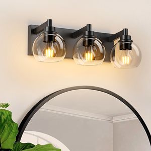 Lampada da Bagno Moderna a 3 Luci con Paralume in Vetro Trasparente e Base in Metallo Nero Opaco per Installazione Sopra lo Specchio - Product Image 1