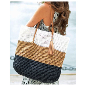 Sac fourre-tout The Shoreline Ember en raphia doré et jute, avec des incrustations de jonc de mer et de rotin pour une ambiance insulaire au coucher du soleil - Product Image 1