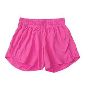 Shorts de sport jaune fluo pour femme, taille élastique, séchage rapide, tissu tricoté avec poches, coupe régulière, taille mi-haute, couleur unie - Product Image 2