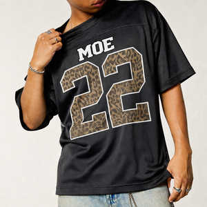 เสื้อเจอร์ซีย์อเมริกันฟุตบอลทรงโอเวอร์ไซส์สำหรับผู้ชาย ปี 2026 ลายพิมพ์เสือดาว หมายเลขพิมพ์แบบเรโทร คุณภาพสูง ผ้าตาข่าย แบบสั่งทำตามเทรนด์ - Product Image 1