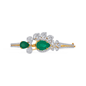 Bracelet en or 18 carats exquis serti de diamants, orné de magnifiques pierres précieuses d'émeraude naturelle et de détails floraux complexes en diamant. - Product Image 1