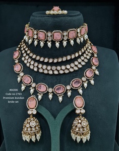 Premium-quality Kundan bridal look set includes a <b>statement</b> choker, layered <b>necklace</b>, matching earrings, - Product Image 1