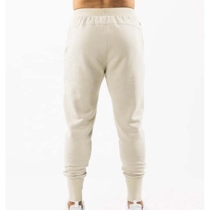 Pantalon de jogging en coton beige pour homme, taille élastique, cordon de serrage, poches latérales, style décontracté streetwear, idéal pour l'automne - Product Image 2