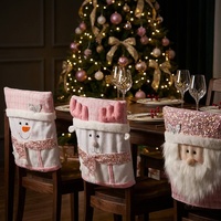 Housse de chaise et de tabouret décorative de Noël rose avec motif bonhomme de neige et renne pour la mise en scène d'une ambiance festive au restaurant et à la maison