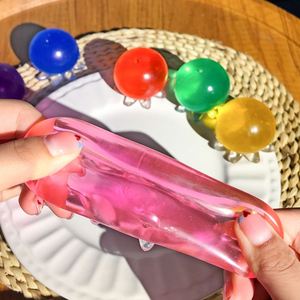 ของเล่นบีบสำหรับเด็กออทิสติก TPR ลูกบอลคลายเครียดรูปปลาหมึกโปร่งใสโลโก้ได้ตามต้องการ - Product Image 4