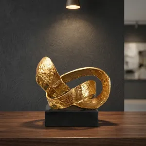 Sculpture métallique abstraite finition or, statue décorative moderne, objet de décoration de table avec base noire pour la maison, le bureau ou le salon - Product Image 2