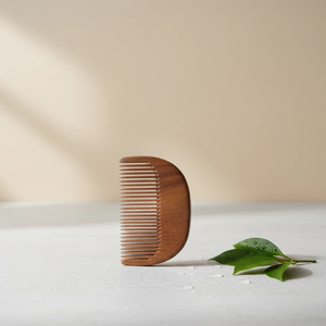 Polished wooden <b>comb</b> designed with a curved ergonomic handle and <b>wide</b> teeth for smooth detangling, available at wholesale prices - Product Image 2