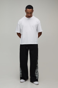 Conjunto de 2 Piezas para Hombre, Camiseta Blanca con Cuello Redondo y Pantalones Anchos Negros con Estampado Animal, Estilo Urbano - Product Image 3