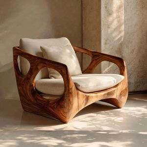 Un fauteuil lounge luxueux en bois massif, fabriqué à la main, aux formes fluides et au confort exceptionnel - Product Image 1