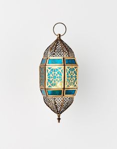 Linterna marroquí clásica colgante de metal para decoración tradicional que realza interiores con un cálido brillo de velas. - Product Image 6