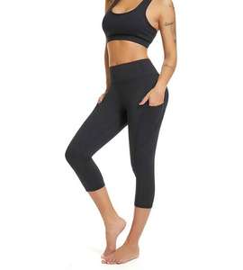 Pantalones de yoga transpirables hasta la rodilla con cintura media y bolsillos laterales de malla para gimnasio, levantamiento de glúteos y entrenamiento, al por mayor - Product Image 3