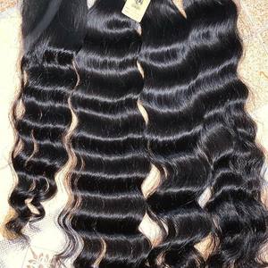 Perruques en gros vendeur de cheveux naturels Remy bruts du Vietnam en vrac humain 100%, machine à double trame, cuticule alignée cheveux ondulés humains de l'océan Ex - Product Image 2