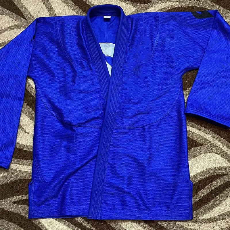 2024 matériel de haute qualité arts martiaux porter taekwondo Poly coton 65/35 uniforme bleu personnalisé marque Design tissu vêtements ensembles