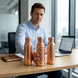 Excellent Quality Pure Copper Water Bottle Assorted Hammered Design health benefits traditional Indian handicrafts at best price - Product Image 1