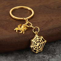 Llavero de aleación con diseño de telaraña calada y cadena para decoración de mochila de Halloween