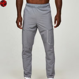 Pantalones cortavientos personalizados al por mayor para hombre, ajustados, 100% poliéster, nailon, pantalones cortavientos para hombre - Product Image 1