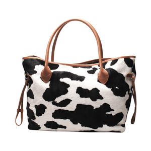 Bolso de mano de piel de vaca marrón de ante personalizable para mujer, 100 unidades, venta al por mayor, bolso de fin de semana grande negro y blanco de piel de vaca, bolso de moda de piel corta con diseño animal - Product Image 1