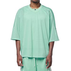 ชุดเสื้อฟุตบอลอเมริกันสีเขียวมิ้นท์พรีเมียม ผ้าตาข่าย แต่งขอบตัดสี ทรงโอเวอร์ไซส์ ไหล่ตก ผลิตตามสั่งแบบ B2B - Product Image 1