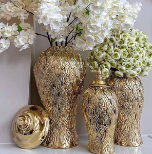 Beautiful classic golden chalice <b>flower</b> trophies presented on a white wooden dresser, available at wholesale prices. - Product Image 5