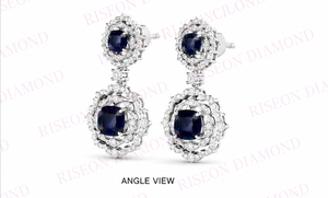 Pendientes colgantes de lujo en oro blanco de 18 quilates con piedras centrales de corte almohadilla en azul real, rodeadas por un intrincado detalle de halo de diamantes. - Product Image 3